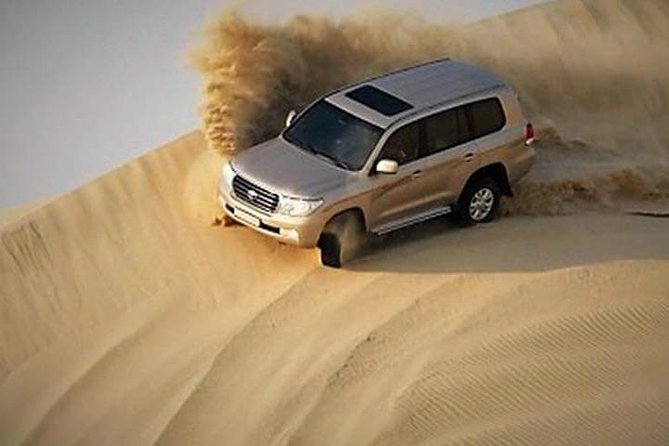 4x4 Deluxe Desert Safari Dubai with Camel Riding - BBQ buffet dinner under the evening sky