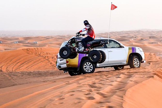 6-Hour Dubai Desert Dinner Safari with Dune Bashing & Camel Ride - Dune bashing in a 4x4