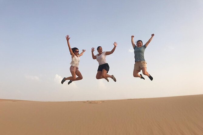 Abu Dhabi: 7-Hours Desert Safari with BBQ, Camel Ride & Sandboarding - Sunset photos and a camel farm stop
