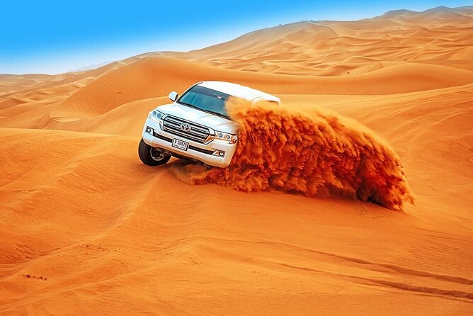 Abu Dhabi Desert Safari BBQ Dinner Live Shows Pick & Drop More - Sunset, sandboarding, and the short camel ride