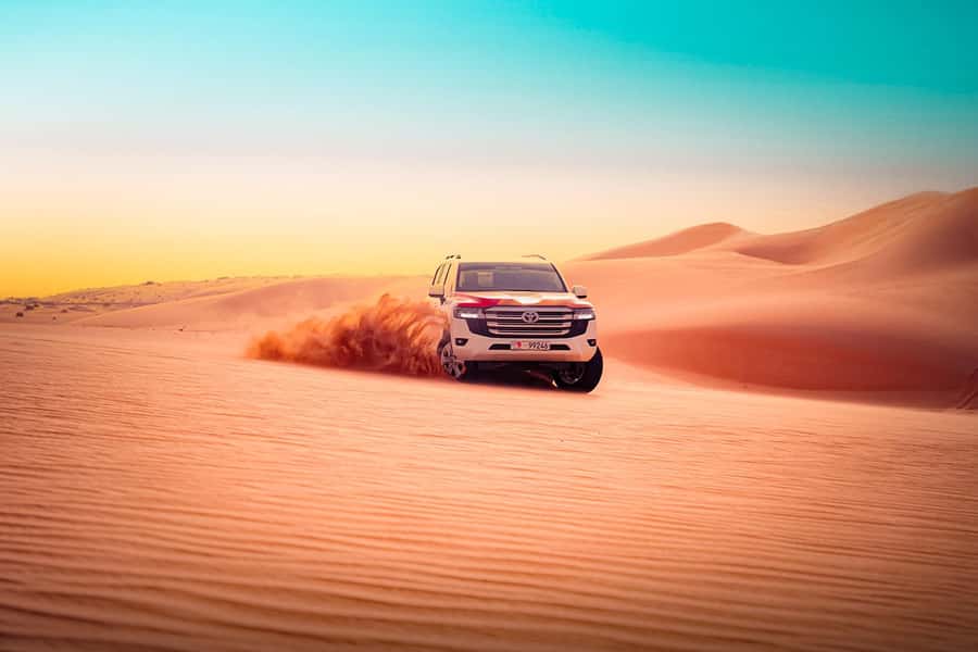Abu Dhabi: Desert Safari with BBQ, Belly & Tannura Dance - Sandboarding and camel riding at the camp