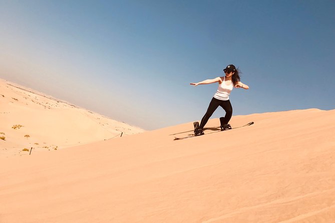 Abu Dhabi Desert safari with BBQ Dinner,Sandboarding & Camel ride - Dune bashing with room for photographs