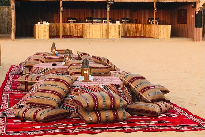Abu Dhabi Desert safari with BBQ Dinner,Sandboarding & Camel ride - Sandboarding across the dunes