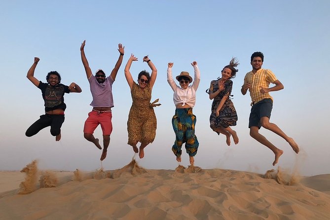 Abu Dhabi Desert Safari with BBQ Dinner & Shows - Sandboarding, camels, and small camp activities