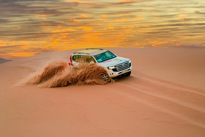 Abu Dhabi Morning Desert Safari: 4x4 Dune Bashing, Camel Ride and Sandboarding - A Bedouin-style camp and simple refreshments