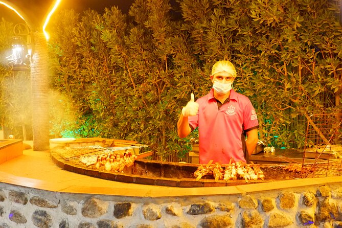 Al Madam Red Sand Safari with BBQ Dinner & Traditional Show - Sandboarding, camels, and optional motor activities