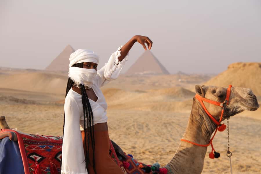 Cairo: Giza Pyramids Tour with Quad Bike Safari & Camel Ride - Camel riding with the pyramids in view