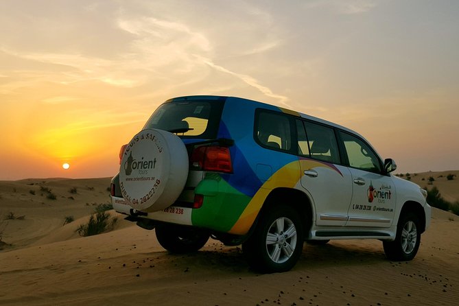 Classic Dubai Desert Safari with BBQ Dinner and Camp activities - A camel farm and a short camel ride