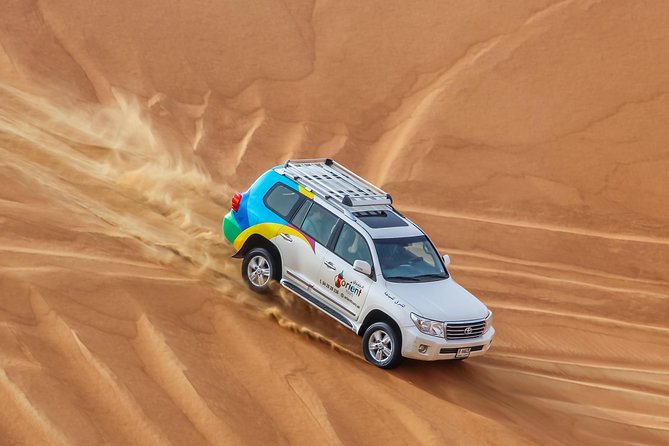 Classic Dubai Desert Safari with BBQ Dinner and Camp activities - The 20-minute dune bashing run