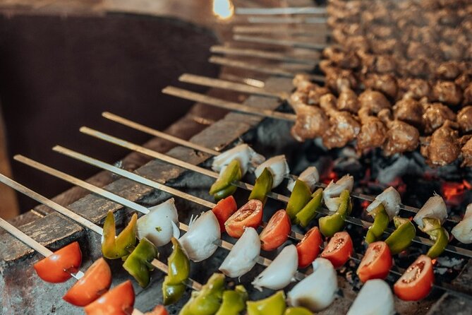Deluxe Sunset Desert Safari: SandSurfing, Camel Ride & BBQ dinner - Arabic coffee, luqaimat, and the camp welcome