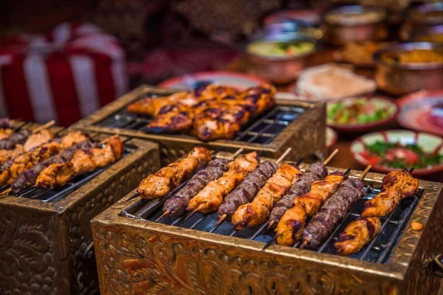 Desert Safari Dubai with Camel Ride, Sandboarding & Dinner - Dune bashing in a 4x4 Land Cruiser