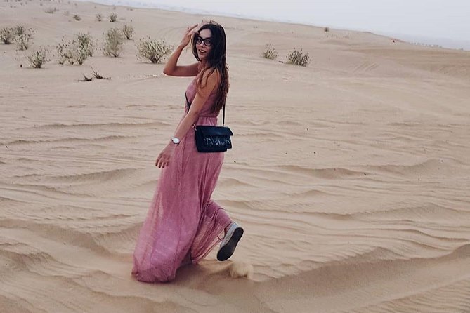 Desert Safari Red Dunes with Camel Ride, Sandboard, BBQ and Shows - Shared transport and group size