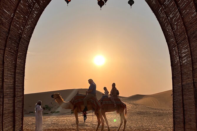 Desert Safari with Dune Bashing and Camel Ride plus Sand Boarding - The sunset stop is worth slowing down for
