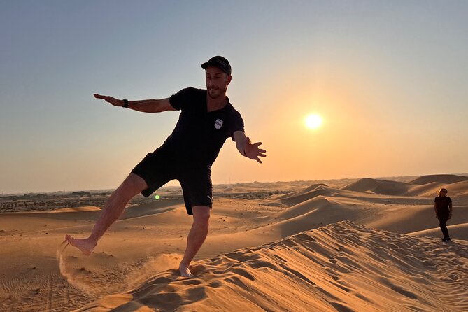 Desert Safari with Dune Bashing and Camel Ride plus Sand Boarding - Sand boarding, henna, and traditional dress