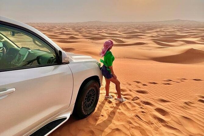 Desert Safari with Quad Bike Camel ride ,SandBoarding ,InalndSea - Your first desert stop: camels, coffee, and preparation