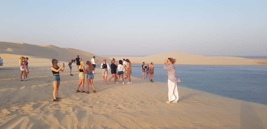 Doha; Desert safari, camel ride, sandboarding, Inland Sea - The Land Cruiser turns toward the dunes