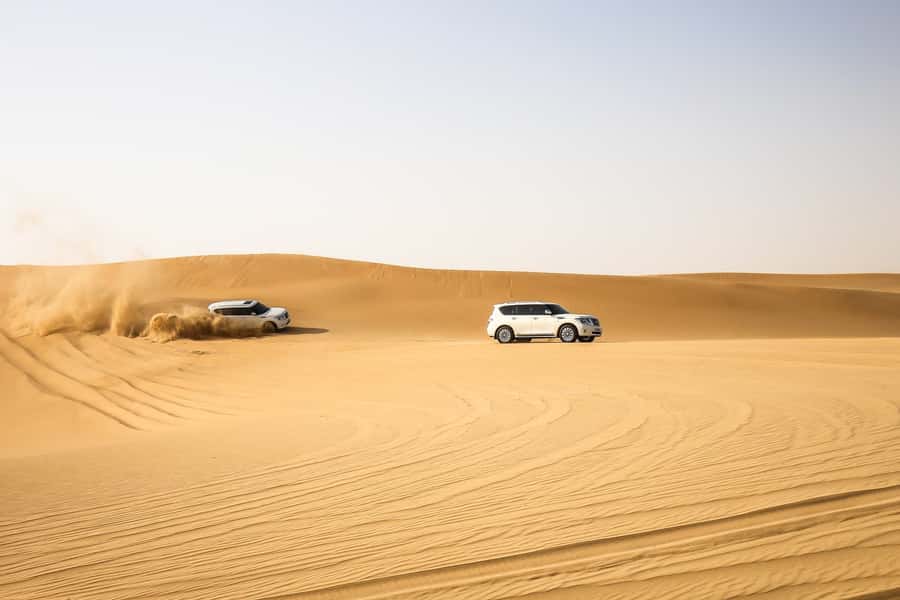 Doha: Desert Safari Dune Bashing, Sandboarding, & Camel Ride - Dune bashing across Qatar’s southern sands