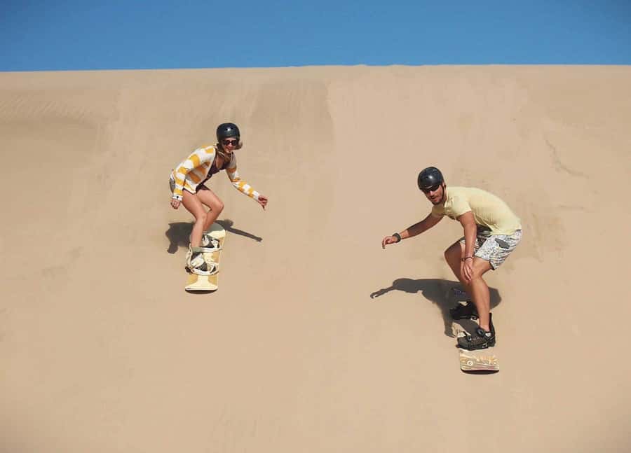 Doha Desert Safari: Sandboarding, Camel Ride & Swimming Fun - Practical clothing and packing advice