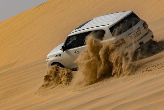 Doha Half Day Desert Safari Dune Bashing Camel Ride Sandboarding - Camel ride, Bedouin tents, and a cup of tea