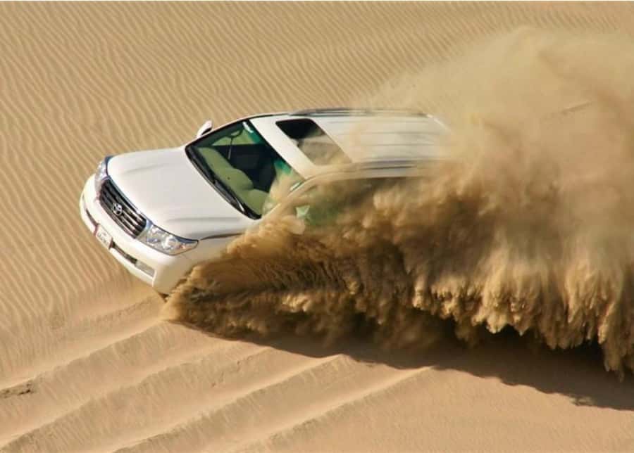 Doha : Inland Sea Desert Safari ,Camel Ride & Sandboarding - Dune bashing is the main burst of excitement