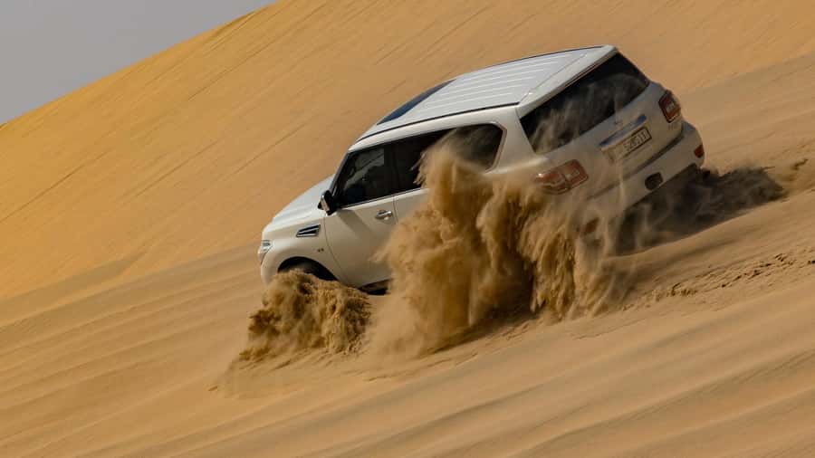 Doha Private Desert Safari, inland sea, sand boarding - Sandboarding and the first run over the dunes