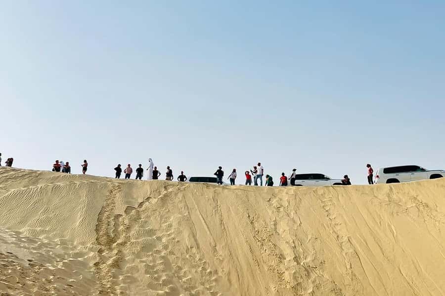 Doha Safari: ATV Ride, Dune Bashing, & Sandboarding Fun - Dune bashing toward Khor Al Udeid