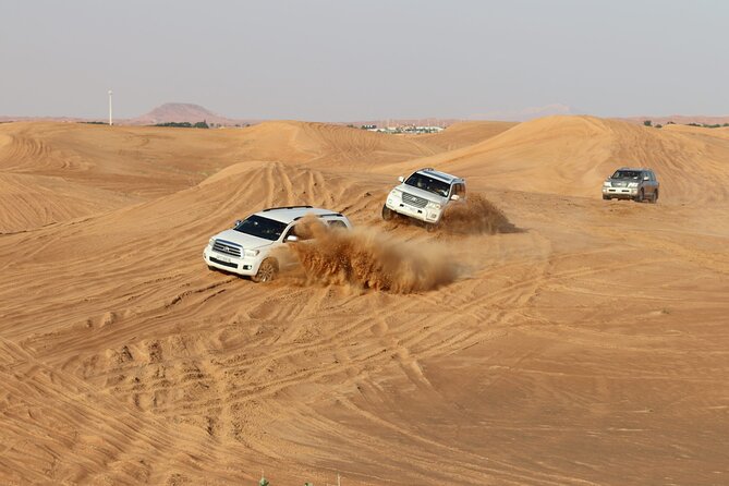 Doha Sharing Desert Safari with Dune Bashing and Sand Boarding - Dune bashing across the rolling sand