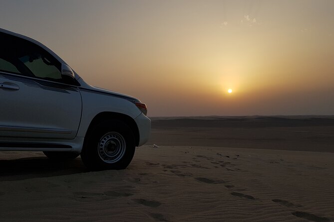 Doha: Sunrise /Sunset Desert Safari with Sand Boarding,Camel ride - Sand boarding adds activity without a long lesson
