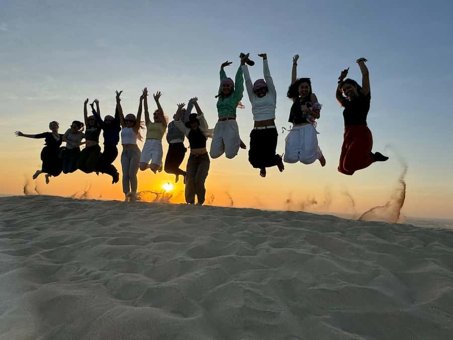 Doha: Sunset Safari, Dune Bashing, Sandboarding & Camel Ride - Meeting the camels at Inland Sea Beach