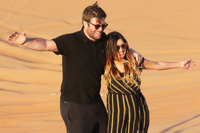 Dubai Desert Bespoke: Red Dunes Safari, Camel Ride & BBQ Options - Sandboarding with a climb back up