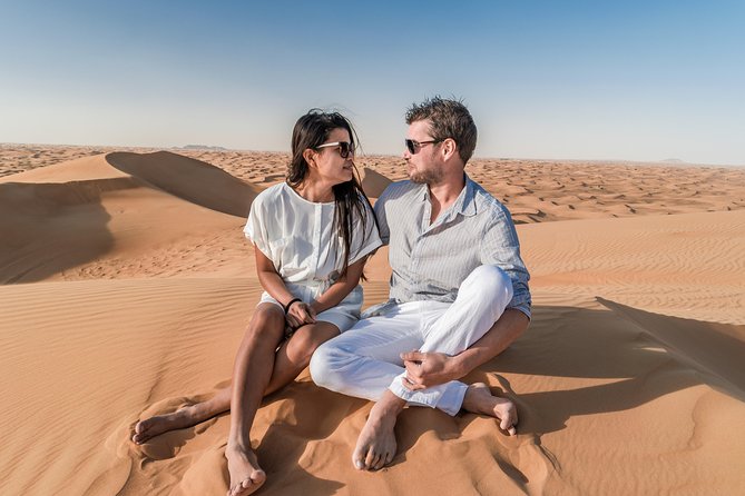 Dubai Desert Discovery: Red Dunes Safari, Sandboard & Camel Ride - First stop at Lahbab: camels, photos, and a short pause