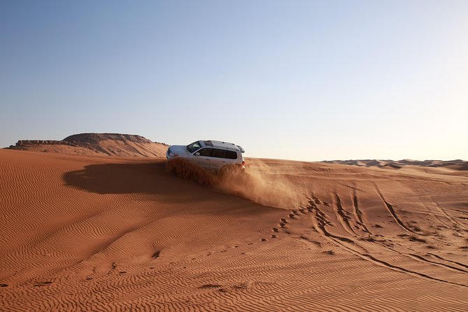 Dubai Desert Discovery: Red Dunes Safari, Sandboard & Camel Ride - Shared transport, private options, and group size