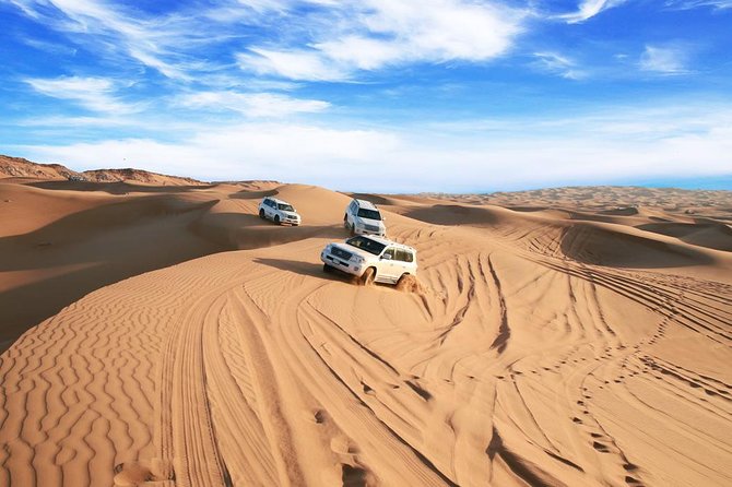 Dubai Desert Journey: Red Dunes Safari with BBQ in Bedouin Camp - Sunset over the red dunes