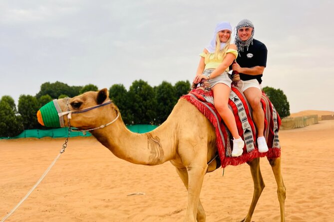 Dubai Desert Safari 20 mins Dune Bashing BBQ Live Show Camel Ride - Belly dancing, fire shows, and a busy evening program