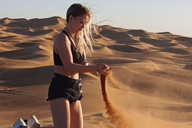 Dubai Desert Safari & Buffet Dinner and Camel ride with PRIVATE CAR - Sandboarding and a sunset photo stop