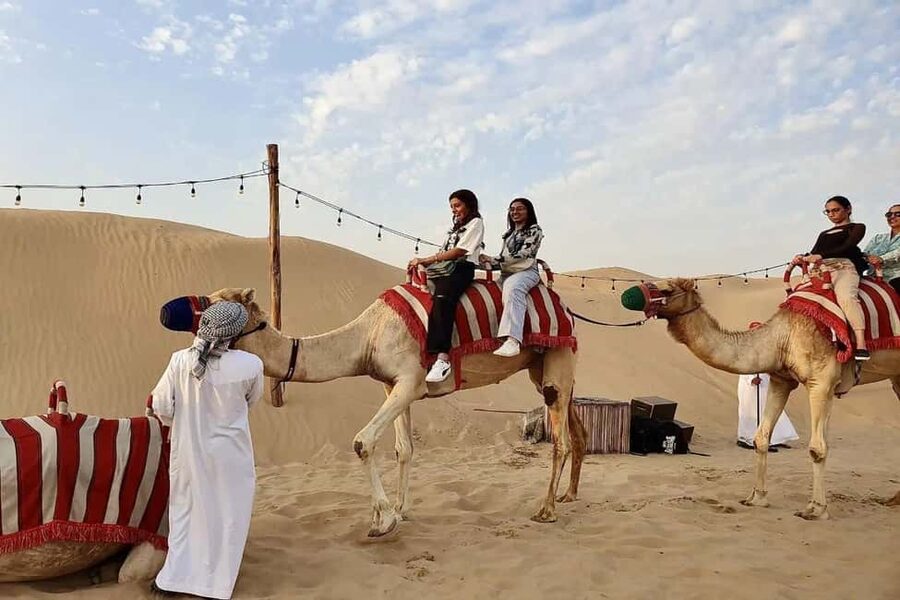 Dubai: Desert Safari, Camel Ride, Quad Bike & BBQ Dinner - Camel riding gives you a quick taste of tradition