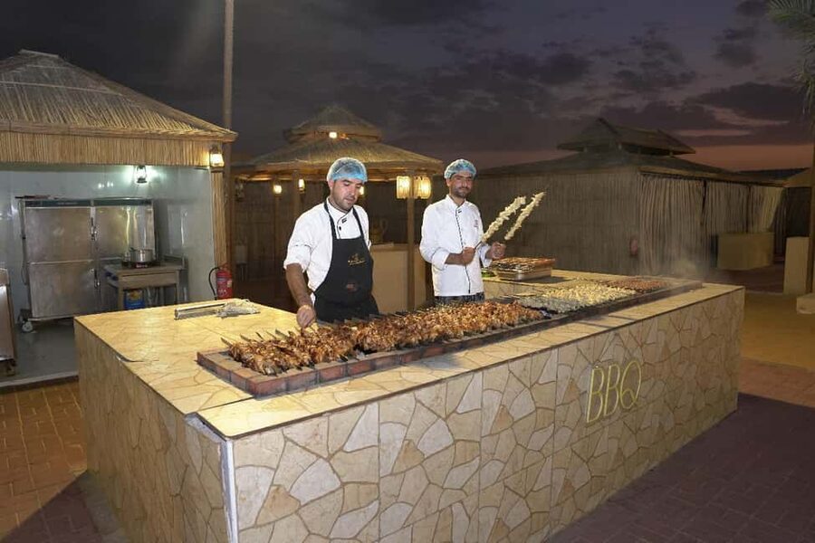 Dubai: Desert Safari, Camel Ride, Quad Bike & BBQ Dinner - Quad biking adds a separate shot of speed