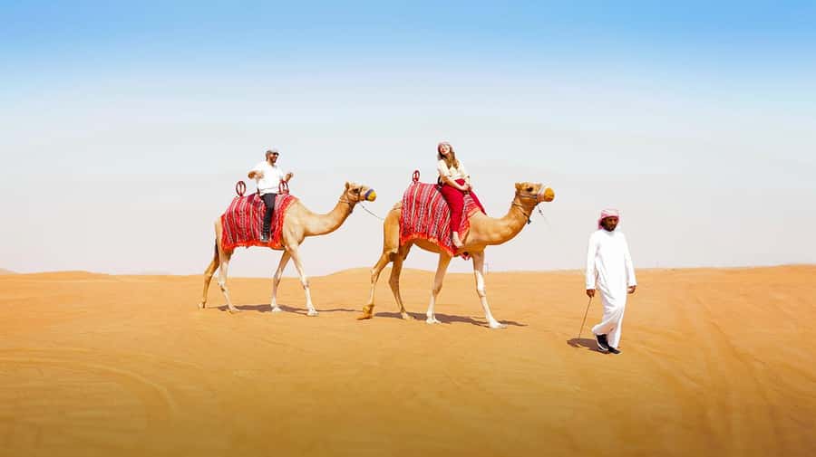 Dubai: Desert Safari, Camel Ride, Sandboarding, Quad Bike - The longer evening option: BBQ, camp, and traditional shows