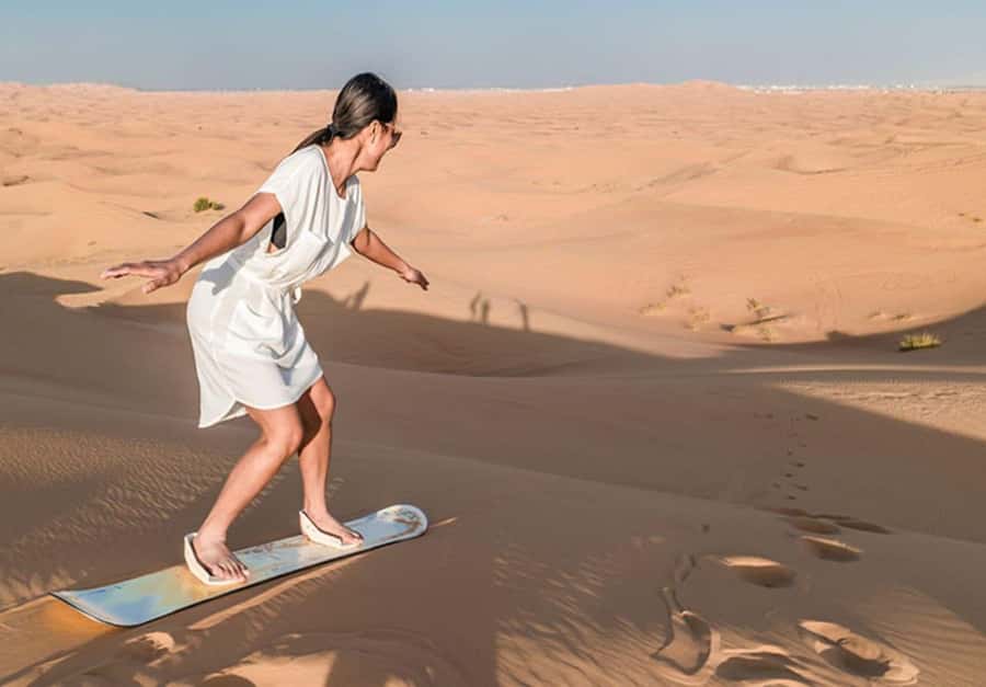 Dubai: Desert Safari Camel Riding, Sandboarding & BBQ Dinner - Sandboarding with time for desert photos