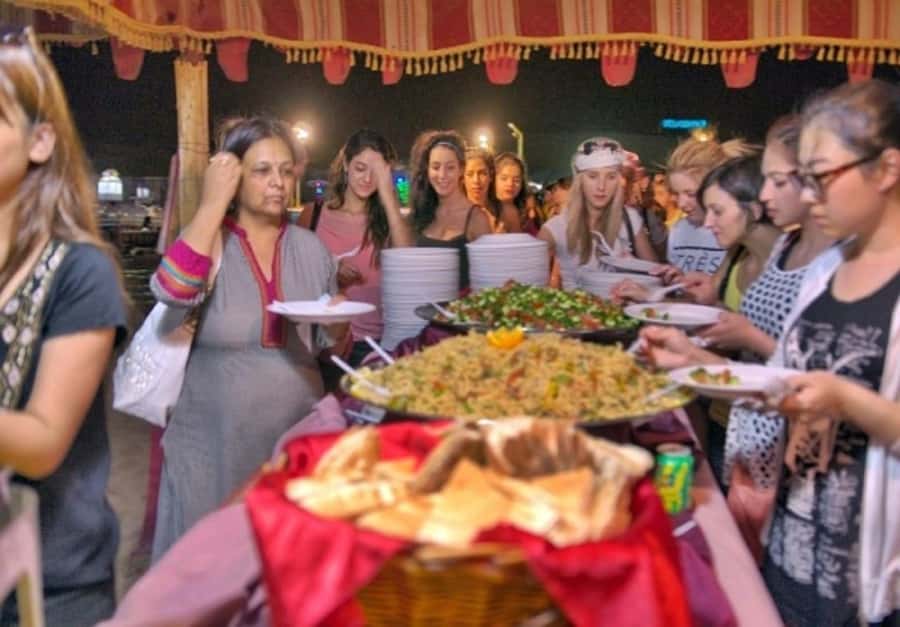 Dubai: Desert Safari Camel Riding, Sandboarding & BBQ Dinner - A short camel ride at sunset