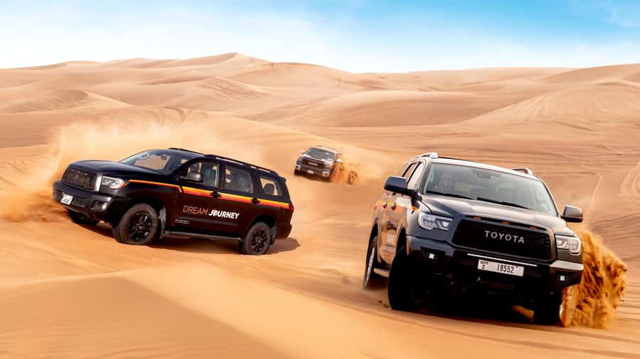 Dubai Desert Safari - Premium BBQ Dinner, Camel Ride & Shows - Sandboarding is easy to try
