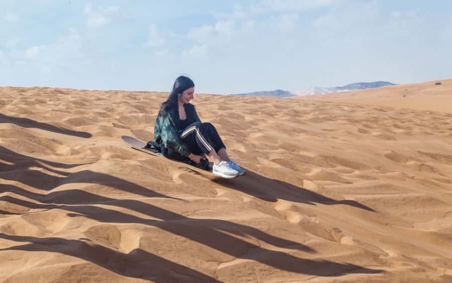 Dubai: Desert Safari, Quad Bike, Camel Ride and Sandboarding - Sandboarding on the high red dunes