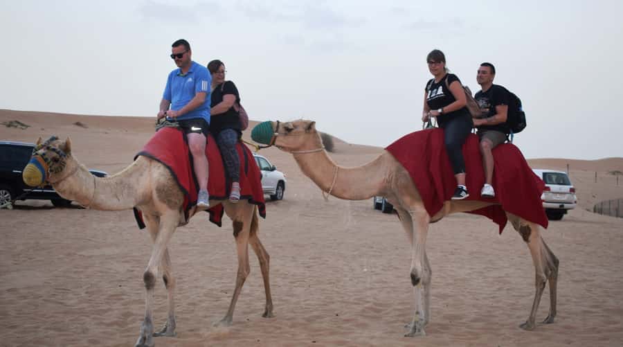 Dubai Desert Safari, Quad Biking, Camel Ride, & Sandboarding - BBQ dinner and the evening program