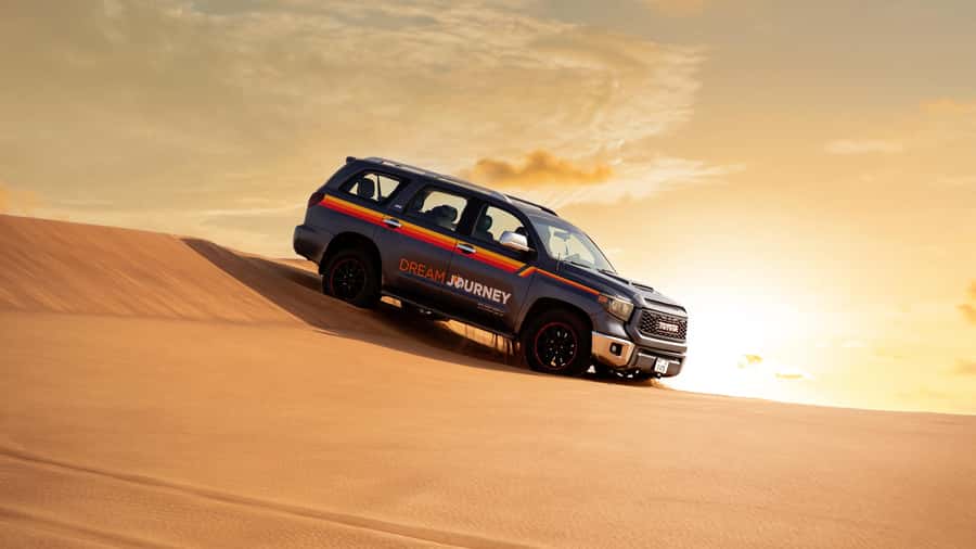Dubai Desert Safari - Sandboarding, Quad Bike & BBQ Options - Sandboarding on soft desert slopes