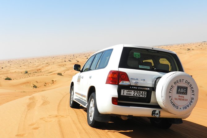 Dubai Desert Safari with BBQ, 3 Shows & Camel Ride at Majlis Camp - Dune bashing across the golden dunes