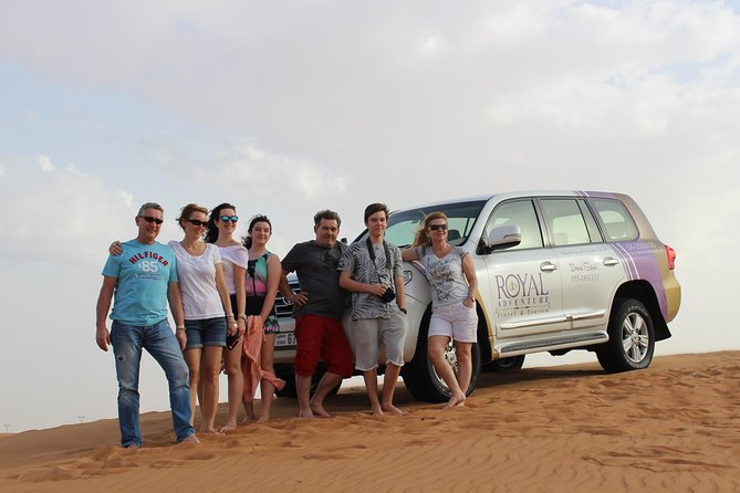 Dubai Desert Safari with BBQ And 4W Land Cruiser Dune Bashing Experience - Sunset, sandboarding, and desert photos