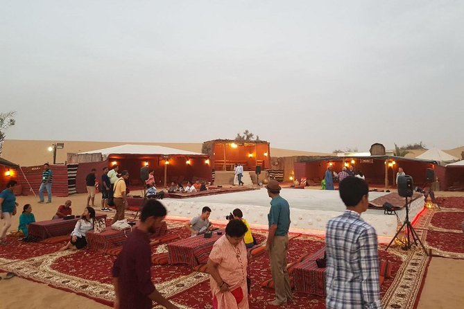 Dubai Desert Safari with Quad Bike, sandboarding, live show & BBQ - Camp arrival, tea, coffee, and a short camel ride