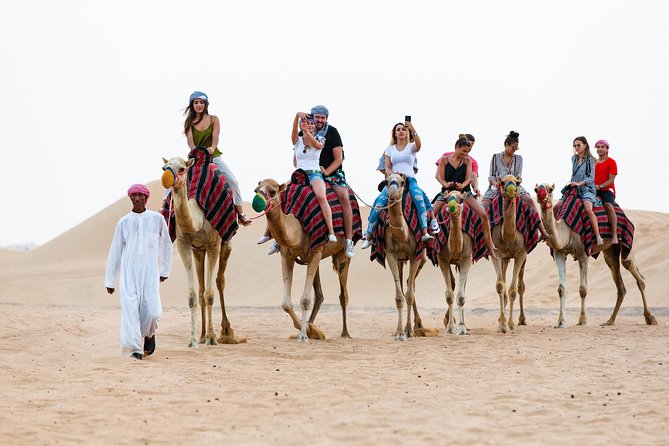 Dubai Desert Safari with Quads, BBQ Dinner, Camel ride, & Shows - From Dubai towers to open sand