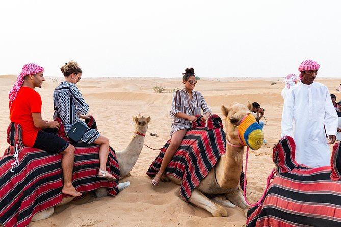Dubai Desert Safari with Quads, BBQ Dinner, Camel ride, & Shows - Arriving at the Bedouin-style camp