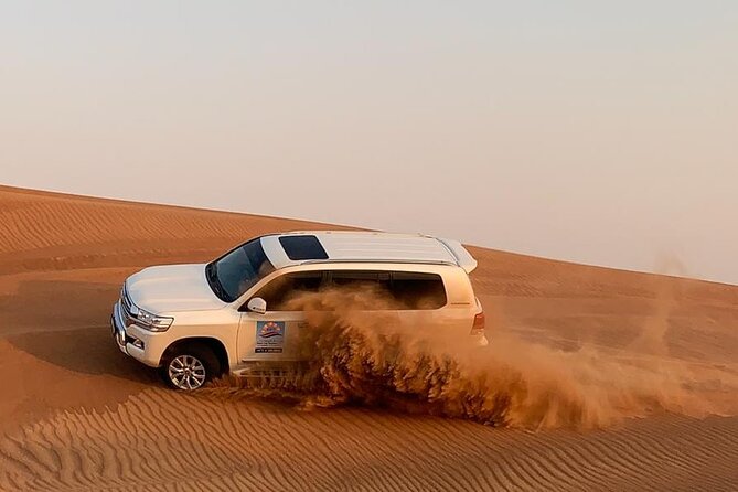 Dubai Evening Desert Safari with BBQ & Live Entertainment - Belly dancing, Tanoura, and the fire show